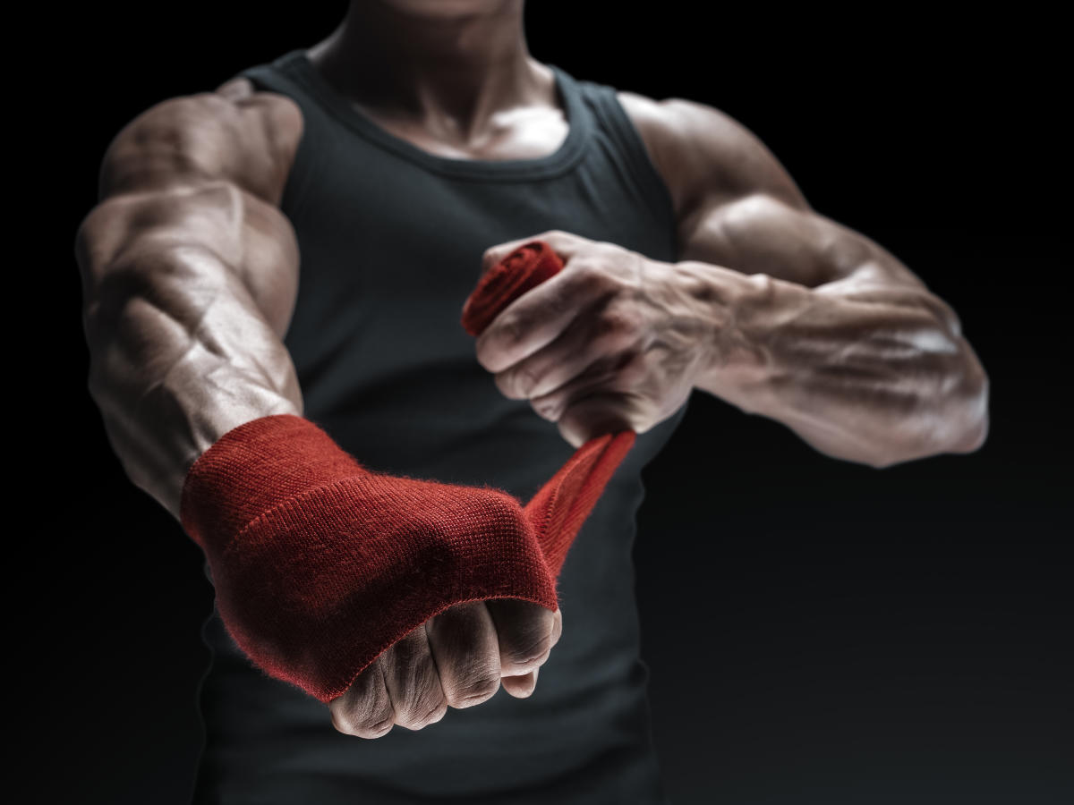 A martial artist in a focused stance, representing discipline, strategy, and power